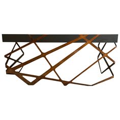 a metal and wood table with geometric design