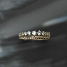 three diamond wedding rings sitting on top of each other