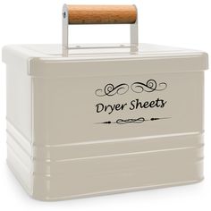 a white storage box with a wooden handle on the top that says, dry sheets