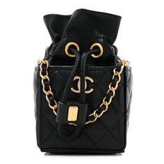 This is an authentic CHANEL Calfskin Quilted Mini Drawstring Bucket Bag in Black. This chic shoulder bag is crafted of luxurious diamond-quilted calfskin in black. The bag features a leather-threaded gold chain shoulder strap and a flap with a matching gold classic CC turn lock. The flap opens to a black leather and fabric interior. 1398289 Chic Evening Shoulder Bag With Diamond Quilting, Luxury Square Bucket Bag For Formal Occasions, Luxury Square Bucket Bag For Evening, Luxury Quilted Pouch Bag, Black Travel Bag With Diamond Quilting, High-end Quilted Bags For Formal Occasions, Black Diamond Quilted Travel Bag, Black Diamond-quilted Travel Bag, High-end Quilted Formal Bag