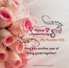 a bouquet of pink roses sitting on top of a white sheet with the words happy anniversary and my beautiful wife