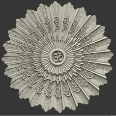 an intricately designed wall hanging with the om symbol