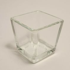 a glass cube sitting on top of a white table