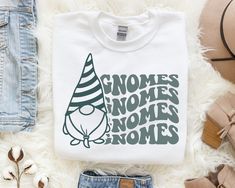 a white shirt with gnomes women's noms and gnomes on it