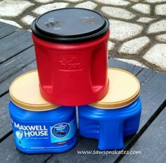 two plastic containers sitting on top of each other next to a blue container with a black lid