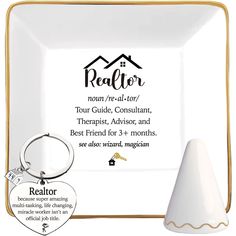 a white and gold plate with a keychain in front of it that says realtor