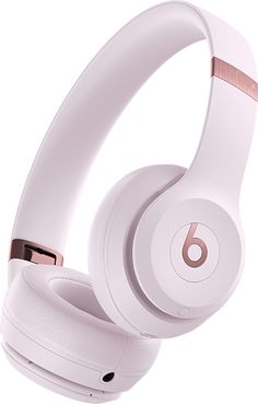 the beats on - ear headphones are white and have rose gold trimmings