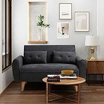 a living room scene with focus on the couch and coffee table in the foreground