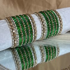 This includes 2 half stacks includes crystal end bangles mixed with green dot maroon bangles.  This set is also available in pink, navy and maroon. Check out other listing on our bangle collection.  Ready to ship 📦 Green Bangle Cuff Bracelet For Party, Festive Green Beaded Bangle Bracelets, Green Beaded Bangle Bracelets For Wedding, Festive Green Stackable Bracelets, Maroon Bangles, Bangle Collection, Rose Bleu, The Bangles, Green Dot