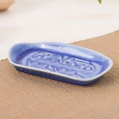 a blue bowl sitting on top of a table