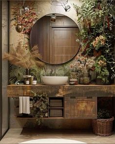 a bathroom with a sink, mirror and plants on the wall