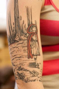 a girl with an umbrella tattoo on her arm