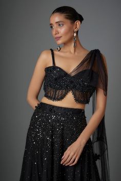 Black can can attached tiered lehenga with sequin embroidery. Comes with padded embellished blouse and attached drape. - Aza Fashions Tiered Lehenga, Lehenga With Blouse, Sequin Embroidery, Embellished Blouse, Can Can, Blouse For Women, Sequins Embroidery, Wedding Collection, Black Sequins