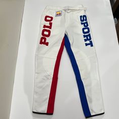 Brand - Ralph Lauren, Polo Sport Gender - Men Item Type - Racing Team, Sweatpants Color - White, Blue & Red Condition- Brand New Features; White Belt 2 Side Pockets 1 Zipped Back Pocket Zip Pants Leg Sizes Available; Men’s Small Fitted White Sporty Sweatpants, White Fitted Sporty Sweatpants, White Fitted Sweatpants, Fitted White Bottoms For Sports Events, Black Pajama Pants, Sports Track Pants, Men Sweatpants, Army Helmet, Ralph Lauren Fleece