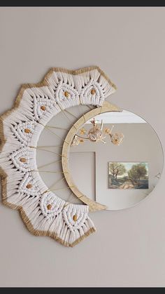 a mirror and some white doily on a wall