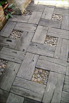 a wooden walkway with rocks and gravel on it