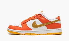 The Women’s Nike Dunk Low “Golden Orange” is a women’s-exclusive version of the retro basketball shoe in a colorway based on an original option from 1985.  The shoe in question is the “Syracuse” Dunk High, a white and orange colorway from the college basketball-inspired “Be True to Your School” collection.  Like the “Syracuse,” the “Golden Orange” features a white leather base with contrasting orange leather overlays.  Unlike the “Syracuse,” the “Golden Orange” dons a Golden Orange-colored leath Womens Dunk Low, Wmns Dunk Low, Dunk Low Nike, Retro Basketball Shoes, Retro Basketball, School Collection, Orange Shoes, Dunk High, White And Orange