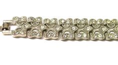 Silver Plated Costume Bracelet  Missing 1 rhinestone by clasp - see picture 3 - not very noticeableMeasures 7-1/4 Inches Long or 18 cmMeasures approximately 3/8" wide or 5 mmTotal Weight: 17.7 Grams082912-386VFEEL FREE TO MESSAGE ME WITH A BEST OFFER OR IF YOU WISH TO SEE MORE PICTURES!We combine shipping where you pay only $1.00 more for any additional items on the same order!_________________________________________________________________________________* Back to Shop Watch and Wares? https:/ Formal Metal Crystal Bracelet With Bling, Diamond White Bling Bracelets For Formal Occasions, Formal Diamond White Bling Bracelets, Vintage Cubic Zirconia Bracelets With Diamond Accents, Silver Rhinestone Bracelets For Anniversary, Crystal Diamond Bracelet With Rhinestones For Wedding, Silver Crystal Bracelet For Formal Occasions, Silver Crystal Bracelet With Handset Stones For Formal Occasions, Bling Diamond Bracelets For Formal Occasions