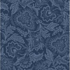 a blue and white floral pattern on a dark background, with an intricate design in the middle