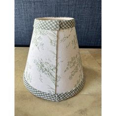 a lamp shade sitting on top of a table