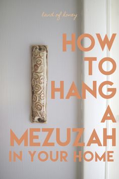 a door handle with the words how to hang a mezuah in your home