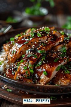 a close up of a plate of food with rice and meat in sauce on it