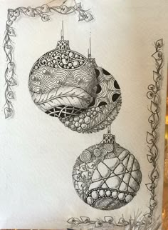 a christmas card with ornaments hanging from it