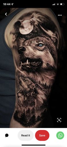 a man's arm with an image of wolfs and the moon on it