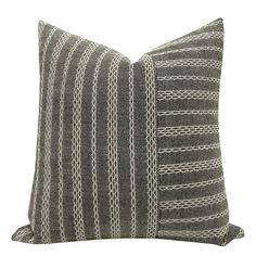 a black and white striped pillow on a white background, with lines drawn across it