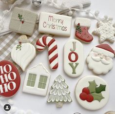 christmas cookies are arranged on a white plate