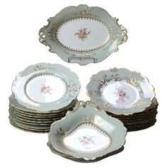 four plates with floral designs on them