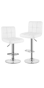 two white bar stools sitting next to each other