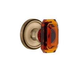 an orange glass door knob on a white background