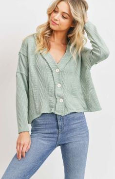 This Cardigan is great to layer over a basic tank or your favorite sundress! The style is a loose fit, long sleeves, and front button closure. Other features: drop shoulder, crop silhouette, and textured cable knit detail. Spring Green Everyday Cardigan, Oversized Button-up Spring Cardigan, Trendy Green Button-up Cardigan, Fitted Green Cotton Cardigan, Spring Green Textured Knit Cardigan, Easter Traditions, Top Pick, Cropped Cardigan, Fun Time