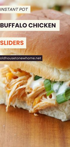 a close up of a sandwich on a wooden table with the words instant pot buffalo chicken sliders