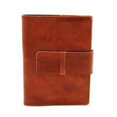 a brown leather journal with a clipping on the front and two flaps in the middle