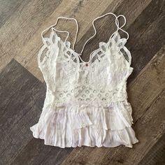 Intimately Free People Adella Cami Top In White New With Tags Size Medium Favorite-Ever Bralette, Now As A Cami Featuring A Flowy, Tiered Design To Complement The Intricate Crochet Lace Top. Crisscross Straps A-Line Silhouette Lined Bust White Beach Camisole With Built-in Bra, White Lace Tops With Built-in Bra, Summer Lace Tank Top Bra Friendly, Summer Bra Friendly Lace Cami Top, White Sleeveless Lace Top With Built-in Bra, Summer Sleeveless Lace Top, Bra Friendly, Summer Sleeveless Bra-friendly Lace Top, Feminine Lace Top With Built-in Bra For Summer, Summer Bra-friendly Lace Top