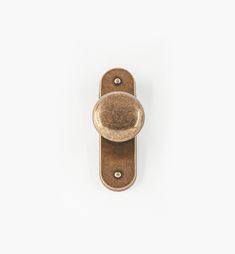 an antique brass door handle on a white background