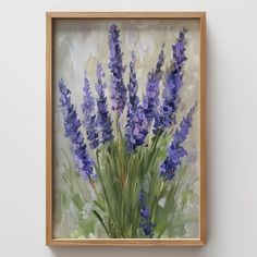 a painting of purple flowers in a wooden frame