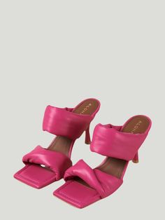 Indulge in unparalleled luxury with our Alohas Magenta Sandals. These exceptional squared-toe mules are meticulously crafted from sumptuous supple leather in a striking bright pink hue, exuding an air of exclusivity and refinement. The distinctive fluted stiletto heels elevate your style, while the two padded straps elegantly embrace the instep for comfort and sophistication. Versatile and chic, these sandals boast a minimal silhouette that effortlessly complements anything from elegant cocktail dresses to casual denim looks. Additional Details: Product Type: Open Toe Sandals Color: Magenta Material: Supple Leather Care Instructions: Wipe clean with a damp cloth Eco-Friendly Brand Magenta Sandals, Elegant Cocktail Dresses, Denim Looks, Elegant Cocktail Dress, Workwear Essentials, Color Magenta, Pink Shade, Long Jumpsuits, Open Toe Sandals