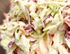 a close up view of a salad with lettuce and carrots