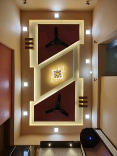 an overhead view of a ceiling fan in a living room with lights on the wall