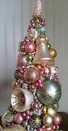 a christmas tree with ornaments and bells on it