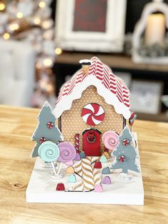 a gingerbread house with candy and candies on it