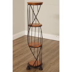 a three tiered metal and wood shelf in the corner of a room with hard wood flooring