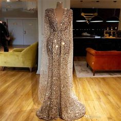 Glamorous Long Sleeve Prom Gown, Glamorous Long Sleeve Gown For Prom Season, Gold Long Sleeve Evening Dress For Formal Occasions, Gold Long Sleeve Evening Dress, Gold Sequined Long Sleeve Dress, Gold Long Sleeve Dress For Evening, Gold Long Sleeve Gown For Weddings, Long Sleeve Mermaid Dress For Wedding And Prom, Gold Floor-length Mermaid Dress For Formal Occasions