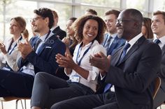 a group of business people clapping in front of an audience stock photo and images gettying