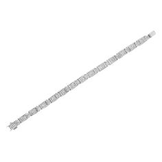 Elegant and timeless, this gorgeous 14K white gold alternating station tennis bracelet features 5.0 carat total weight of invisible set, princess cut diamonds with a whopping 252 stones in all. The tennis bracelet features alternating small and large hinged rectangular links inset with rows of square diamonds. The 7Ã¢â‚¬Â bracelet fastens with a box with tongue clasp. This authentic design is crafted of real 14 karat gold, a precious metal that will keep a tarnish-free shine for years to come. Formal White Gold Rectangular Tennis Bracelet, Formal White Gold Tennis Bracelet With Rectangular Shape, Platinum Bracelets With Baguette Diamonds In White Gold, Classic White Gold Tennis Bracelet, Silver Diamond Bracelet With Baguette Diamonds, White Gold Rectangular Tennis Bracelet For Anniversary, Classic White Gold Rectangular Diamond Bracelet, Classic White Gold Diamond Bracelet, Rectangular Shape, Classic White Gold Diamond Bracelet With Rectangular Shape