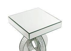 a glass and metal table with a mirror on top