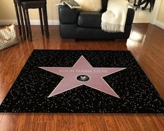 a star on the hollywood walk of fame in front of a black couch and chair